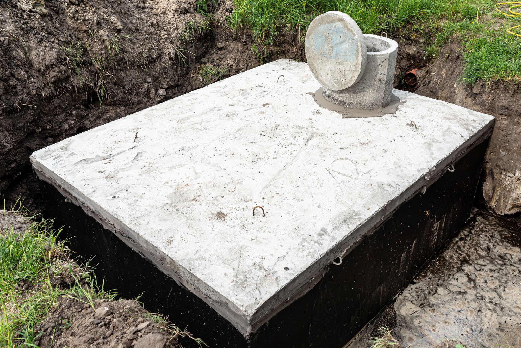 Residential septic system components in a landscaped yard